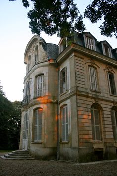 an old building with many windows and stairs