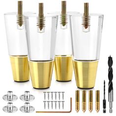 three gold colored shot glasses with screws in them and several other tools to use