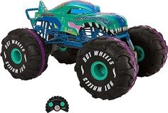 a toy monster truck with large tires and teeth on it's front wheels,