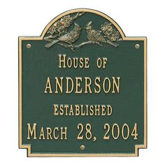 a sign for the house of anderson established in march 28, 2004 with two birds on it