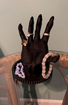 a fake hand is on top of a glass table