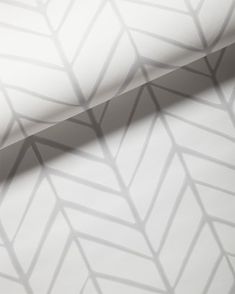 an image of a white wallpaper with grey lines on the side and diagonals