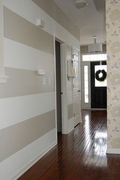 an image of a hallway with wallpaper on the walls