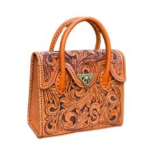 Beautiful masterpiece! The Mini Rommy model is a hand-tooled leather satchel bag, made by skilled craftsmen using traditional leather working techniques. It is a versatile and stylish bag that is perfect for everyday life. The leather is high quality and the tooling adds a unique touch to the bag. Made from Full-grain leather, each bag varies in shading due to the thickness which is determined by the age of the animal and the natural creases of the leather itself: hence, each bag’s color and cha Western Hand Tooled Bags For Daily Use, Western Style Hand-tooled Bags For Everyday Use, Western Hand-tooled Bag For Daily Use, Western Style Hand-tooled Bag For Daily Use, Leather Hand Tooled Shoulder Bag For Western-themed Events, Hand Tooled Leather Bags For Western-themed Events, Hand-tooled Leather Bags For Western-themed Events, Western Hand Tooled Travel Bag, Western Style Hand-tooled Travel Bag