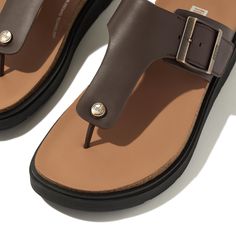 Our next-generation sandals bring a refined modern edge (and our original ultra-cushioning tech) to the classic T-bar leather toe-post sandal. Boasting a directional chunky sole and simple soft-leather strap, with a logo'd stud at the front. A square brushed-metal buckle gives a customized fit. While minimal stitching, leather welt sole detail, and leather linings add to the elevated feel. On a light clean-look version of our triple-density Microwobbleboard™ midsole, biomechanically engineered f Leather T-strap Sandals With Cushioned Footbed, Classic Leather T-strap Toe Post Sandals, Classic T-strap Sandals With Cushioned Footbed, Classic T-strap Sandals With Textured Footbed, Leather Toe Post Footbed Sandals With Textured Footbed, Modern Leather Flip Flops With Leather Footbed, Leather T-strap Toe Post Sandals With Arch Support, Leather Toe Post Footbed Sandals With Arch Support, Modern T-strap Sandals With Cushioned Footbed