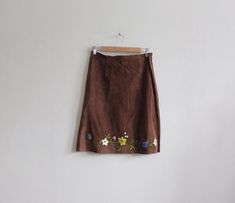 Vintage Joseph Altier Walker 1990s/Y2K skirt in dark brown suede leather with waistband-less waist, a-line silhouette, side zipper, unfinished hem, short mini length, and heavy beaded and embroidered floral motif along hem. Skirt is unlined. Good vintage condition with some overall wear including scuffs and marks on suede. full garment measurements: waist: 31" hip: 38.75" length: 22.75" size marked: Large fits like: Medium label: Joseph Altier Walker genuine leather Please, take these measurements into consideration and compare them to a similar item of your own to ensure a good fit. All sales final. shop more vintage skirts & pants: http://etsy.me/29Wh98e visit the shop: https://www.etsy.com/shop/tobedetermined Beautiful Nightgown, Brown Suede Skirt, Y2k Skirt, Vintage Skirts, Suede Skirt, Hem Skirt, Blue Satin, Black Midi Dress, Vintage Skirt