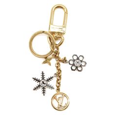 Description Iconic Louis Vuitton Elements Get A Festive Winter Update With The Lv Snowflakes Bag Charm And Key Holder. This Whimsical Piece Showcases Snowflake-Shaped Charms Together With Lv Circle And Monogram Flower Pendants. Shimmering Strass Accents And A Finely Engraved Louis Vuitton Signature Add Special Touches. Detailed Features Gold And Silver-Color Hardware Strass Accents Bicolor Hardware Finishlv Circle And Monogram Flower Charms Dual Function As Keyring And Bag Charm Louis Vuitton Signature Engraving On Snap Hook And Ring Winter Update, Chanel Designer, Louis Vuitton Designer, Louis Vuitton Accessories, Flower Charm, Flower Pendant, Key Holder, Silver Color, Women's Accessories