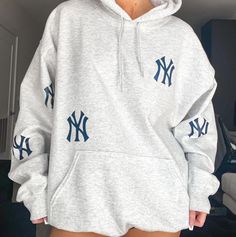 Custom Yankees hoodie. Size featured in photo is size XL.  Material is 50% cotton, 50% polyester. WASH INSTRUCTIONS __ ♥ Wash INSIDE OUT ♥ Wash in cold water ♥ Use mild detergents ♥ Dry on low setting or hang dry New York Yankees Hoodie, Yankee Sweatshirt, Yankee Hoodie, Etsy Sweatshirts, Yankees Sweatshirt, Ny Hoodie, Yankees Hoodie, New York Hoodie, Ny Style