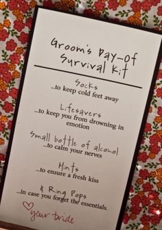 a card that is on top of a table with flowers and the words groom's pay - off survival kit