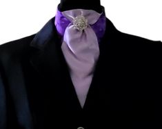 "Use this lovely tie to accent the rest of your outfit!  Royal purple and Lavender really compliment each other! One of a kind, handcrafted pre-tied dressage tie, silver pins may vary. Different sizes available.  *Youth/Petite-Fits neck sizes 12\"-13\" *Standard-Fits neck sizes 14\"-15\" *Large-Fits neck sizes 16\"-17\" Need something custom?  Message me, maybe I can create it for you!" Fitted Purple Suit And Tie Accessories For Party, Elegant Purple Party Ties, Elegant Lavender Ties For Formal Occasions, Elegant Lavender Standard Tie, Elegant Lavender Ties For Black Tie Events, Elegant Lavender Tie For Black Tie Events, Elegant Lavender Standard Tie For Suit, Silver Party Tie, Formal Lavender Fitted Suit And Tie Accessories