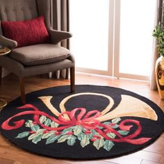 a living room with a chair and rug on the floor