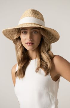 A curved brim enhances the breezy sophistication of this woven raffia hat finished with a wide grosgrain band. Interior size-adjuster band Raffia straw Spot clean Imported Womens Straw Hats, Helen Kaminski, Raffia Hat, Straw Sun Hat, Straw Hats, Woven Raffia, Sun Hat, Straw Hat, Summer 2024