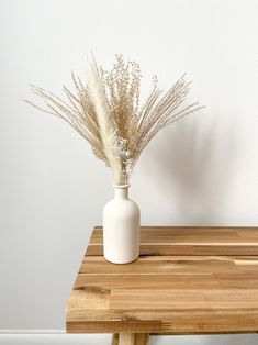 A small pampas bouquet with an option to add a beige, grey or black hand painted vase. These mini dried flower arrangements are ideal as a table centrepiece for a wedding or event, adding to a side or coffee table, and also perfect as gift for home decor lovers.  Vase Dimensions - Height 14cm - Width 6cm. Bouquet Dimensions - Stems range from 25cm to 35cm tall.  This arrangement has been hand tied with a silk ribbon. We suggest keeping the bouquet tied in the vase to ensure the bouquet keeps its Lovers Vase, Flowers Small Vase, Mini Arrangements, Pampas Bouquet, Vase And Flowers, Vase Beige, Pampas Grass Bouquet, Japanese Vase, Painted Vase