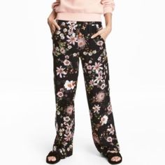 Wide, High-Waisted Trousers In A Soft, Patterned Viscose Weave. Wide Elastication At The Waist And Side Pockets. Black/Floral Composition: Viscose 100% Care Instructions: Machine Wash At 30, Follow Care Label Concept: Everyday Fashion Us 6, Eur 36, Ca 6, Cn 165/68a, Mx 6 (H&M Sizing) Inseam: 28 5/8", Top Of Wb Flat: 13 1/2" (27 Total) Never Worn, Tag Still Attached. It's Just Been Sitting Folded In A Box In My Closet Lol Casual Fitted Viscose Bottoms, Fitted Casual Viscose Bottoms, Fitted Viscose Casual Bottoms, Fitted Casual Viscose Pants, Casual Floral Print Pants For Daywear, Floral Print Wide Leg Bottoms In Viscose, Casual Floral Print Pants, High Waist Viscose Pants For Spring, Black Summer Pants For Daywear