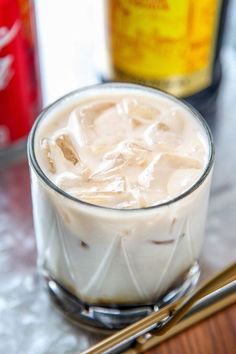 a close up of a drink in a glass with the words colorado bulldog above it