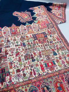 an antique persian rug is laying on the floor next to it's matching fabric