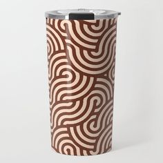 a brown and white pattern on a travel mug