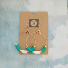 These gorgeous gold, green and white Heishi hoop earrings are made from brightly coloured polymer clay, perfect for adding pops of colour to any outfit! Perfect for a beach holiday or festival! Hoops and earring hooks are made from plated gold or plated silver.  Each pair of earrings has been handmade by Mizzle & Tink. Should you want a certain colour way or order of colours, please do get in touch as I can always make a bespoke pair! Earrings are packaged in a smart black earring box, like the Earrings Trend 2024, Heishi Earrings, Black Earring, Diy Leather Earrings, Diy Jewelry Projects, Polymer Beads, Clay Bracelet