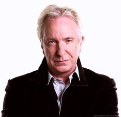 an older man with white hair wearing a jacket and tie