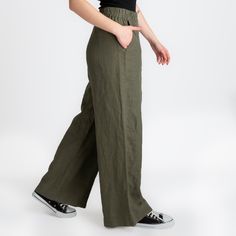 We use GOTS, OCS, GRS, European Flax and Oeko Tex certified linen fabrics. All of our products are handmade from 100% LINEN.  Product Description  - Wide leg palazzo pant - Elastic waistband  - Mid-waisted  - Side pockets  - Straight leg design  - Color seen in the photo Hunter - **You can request special measurements for exact fit ★ Model ★ - Model is 5′8″ (175cm) tall,  - She wears M Bust 87cm(34.2″)  Waist 82cm(32.2″)  Hips 96cm(37.7″) 🧼 Washing - Drying Process 🧼 The product has been washed and softened. It will not shrink when you wash it according to the rules. You can machine wash in cold water at 30o on a delicate program. You will get the best results if you hang it to dry. Dry it in the dryer at low temperature and on a short program. However, if you prefer to iron it, iron it Green Linen Bottoms With Side Pockets, Khaki High-waisted Casual Pants, Casual Khaki High-waisted Pants, High Waist Stretch Linen Bottoms, High Waisted Stretch Linen Bottoms, Non-stretch Wide Leg Khaki Pants, Khaki Wide Leg High-waisted Pants With Elastic Waistband, Khaki High-waist Relaxed Fit Pants, High Waist Relaxed Fit Khaki Pants