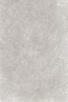 a white tile floor with some dirt on it