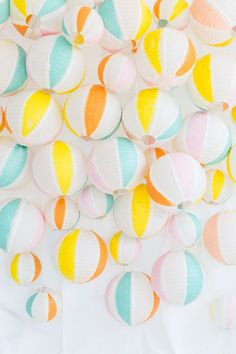 colorful striped paper lanterns hanging from the ceiling