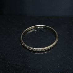 *Description: This is a great Whiting & Davis embossed gold tone floral bangle bracelet from the late 1960s to 1970s. The bracelet is in great condition and is signed on the inside of the bangle. This would be a great vintage bangle bracelet for your collection of Whiting & Davis and would also make a great gift. It would be the perfect bracelet to layer with other bangles. It is an over the hand bracelet, no clasp. *Approximate Measurements: Length - 7 1/2 Inches, Width - 1/4 Inch *Cond Amp Davis, Bangle Bracelet Gold, Formal Earrings, Vintage Bangle Bracelets, Vintage Christmas Gifts, Book Pieces, Late 1960s, Vintage Bangles, Hand Bracelet