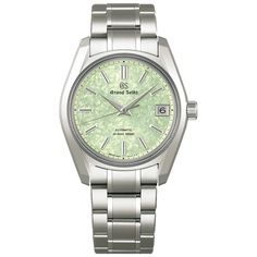 This elegant 38mm wristwatch is a modern interpretation of the celebrated 62GS, Grand Seiko's first mechanical model to feature automatic winding. A masterpiece of design, it embodies the "evolution of practicality" that has been central to Grand Seiko since its inception. The light-green dial is inspired by the new leaves that bud on cherry trees around the end of spring. The dial's color is meant to express the vibrancy of the fresh new leaves as sunlight penetrates their translucence in the s Elegant Green Chronometer Watch, Formal Green Watch With Polished Finish, End Of Spring, Cherry Blossom Petals, Mechanical Model, Rolex Tudor, Rolex Sea Dweller, Rolex Cosmograph Daytona, Grand Seiko