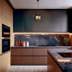 a modern kitchen with marble counter tops and wooden cabinetry, along with an island