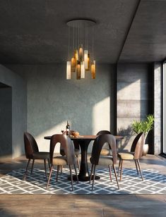 a dining room table and chairs with lights hanging from the ceiling