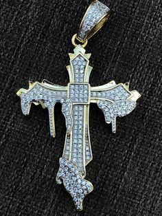 Gorgeous dripping cross!
You will love this piece ITS VERY UNIQUE 
SUPER ICY!
Solid 925 sterling silver...never turns green
We have 3 styles! Rhodium finished, two-toned, & 14k yellow gold finished!
Color lasts many years (if you worried about color changing get the unplated silver one...that will last a lifetime) 
Measures roughly 2.25" by 1.25" ...weighs roughly 6.5 grams
200 micropaved handset man made diamonds (CZ) for a total of 2ct! 
SO ICY IT WILL BLIND YOU!
10 Iced Out Sterling Silver Jewelry For Streetwear, White Bling Jewelry For Streetwear, Silver Iced Out Cross Pendant Necklace, White Gold Bling Cross Jewelry, Iced Out White Gold Cross Pendant Jewelry, White Iced Out Cross Jewelry, White Iced Out Cross Necklaces, White Iced Out Cross Necklace, Silver Cross Jewelry With Bling