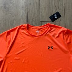 Nwt Under Armour Bright Orange Polyester T-Shirt Great For Hunting New With Tags Men’s Size (Xl Is Just What Is Photographed) 100% Polyester Orange Crew Neck Sports Top, Orange Crew Neck Workout Top, Orange Crew Neck Tops For Workout, Casual Orange Moisture-wicking Tops, Under Armour Crew Neck Streetwear Top, Under Armour Crew Neck Top For Streetwear, Orange Crew Neck T-shirt With Moisture-wicking, Orange Sporty Crew Neck Top, Under Armour Crew Neck T-shirt For Streetwear