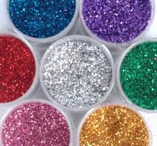 six different colors of glitter in plastic containers