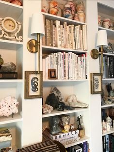 the bookshelves are filled with many different items and decorating them for display