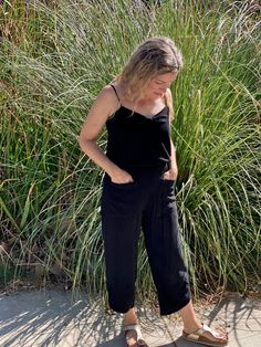 A pant favorite for all shapes and sizes. With the coziness of these pants buying both colors is a great idea. They have a soft elastic waist and 2 large pockets in the front that will fit your phone. There's a bit of fun added with the tulip sewn hem. Goes Perfect with the Corfu tank Black Summer Pants For Everyday, Relaxed Linen Pants With Side Pockets, Casual Black Linen Pants, Relaxed Black Pants For Everyday, Relaxed Black Bottoms For Everyday, Everyday Harem Pants With Loosely Fitted Hips, Loosely Fitted Harem Pants With Pockets For Everyday, Black Linen Harem Pants For Spring, Relaxed Fit Summer Pants With Slip Pockets