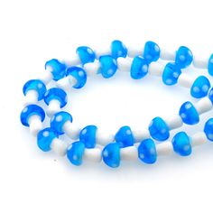 two strands of blue and white beads on a white background with space for the bead