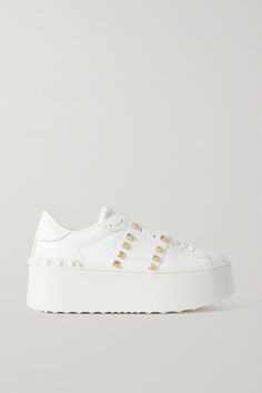 Valentino Garavani's sneakers debuted in the brand's 'Rockstud Untitled' collection in collaboration with artist Vanessa Beecroft. This pair is made from white leather and grounded on sturdy platform rubber soles. The label's signature pyramid studs trace the sides and heel. Valentino Platform, Vanessa Beecroft, Valentino Shoes Sneakers, Valentino Garavani Sneakers, Valentino Sneakers, Valentino Garavani Shoes, Valentino Rockstud, Valentino Shoes, Brown Sneakers