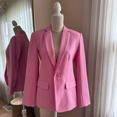 Trina Turk Pink Blazer Size 2 Comes With Tags Notch Lapel - Front Single Button Closure - Long Sleeves With Three Button Cuffs - 2 Front Flap Welt Pockets - Lined - Solid - Back Vent - Approx. 28" Length Shell: 63% Polyester, 32% Viscose, 5% Elastane Lining: 94% Polyester, 6% Elastane Model's Stats For Sizing: - Height: 5'10" - Bust: 32" - Waist: 23" - Hips: 35" Model Is Wearing Size 2. Pink Workwear Blazer With Button Cuffs, Pink Fall Blazer With Button Cuffs, Fall Pink Blazer With Button Cuffs, Pink Blazer With Button Cuffs For Fall, Herringbone Blazer, Tuxedo Style, Crop Blazer, Single Button Blazer, Wool Blend Jacket