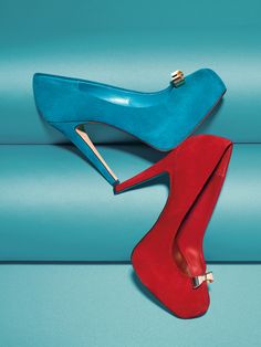 two pairs of red and blue high heels