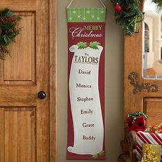 a christmas banner hanging on the wall next to a door