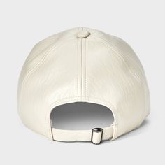 a white leather baseball cap with an adjustable visor