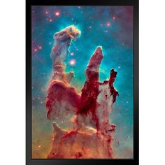 an image of the pillars in the sky with stars and dust on it, framed in black wood