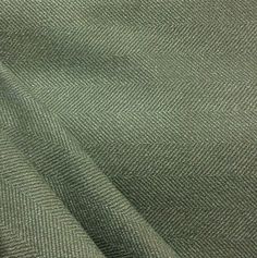 a close up view of a green fabric