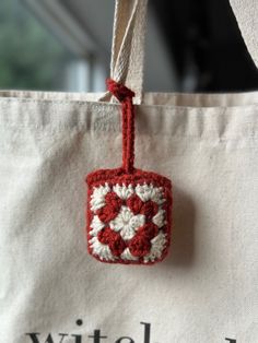 Crochet granny square bag charm Crochet Travel Items, Airpod Bag Crochet, Airpod Holder Crochet, Crochet Bag Pouch Charms, Crochet Purse Accessories, Crocheted Airpod Case, Granny Square Airpod Case, Airpod Pro Crochet Case, Crochet Bag Ideas Inspiration