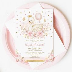 a pink and gold birthday party with a swan on it's back, surrounded by confetti