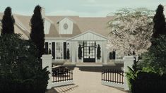 an artist's rendering of a white house with black shutters and gated driveway