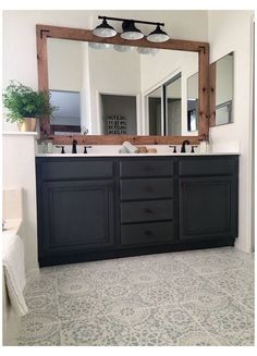 a bathroom with two sinks and a large mirror over it's sink area,