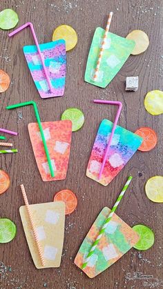 colorful paper straws and drinks on a wooden table