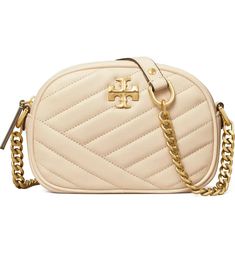 NWT TORY BURCH Kira Chevron Camera Small Leather Crossbody Bag - 100% Authentic Guaranteed! From a reliable and experienced Top Rated Plus US seller, 17 years on eBay! Color: New Cream with Brass hardware   - 100% Authentic Guaranteed! Receipt copy available upon request (after purchase)! - New with tag attached, never been used, comes with dust bag! - Excellent gift idea!  A chevron patterned silhouette with standout logo detailing, Tory Burch's leather crossbody is a timeless piece:  Genuine, smooth, leather Gold-tone logo emblem at front Adjustable crossbody strap, ~21" drop Approximate size: 7.25"W x 5"H x 2.5"D Zip closure Interior zip pocket, two interior slip pockets Asymmetric chevron quilting Fabric lining Comes with Tory dust bag From smoke free/pet free environment. Check out ou Tory Burch Kira Chevron Camera Bag, Tory Burch Kira Chevron, Tory Burch Crossbody Bag, Kira Chevron, Tory Burch Crossbody, Tory Burch Kira, Leather Camera Bag, Tory Burch Handbags, Tory Burch Bag