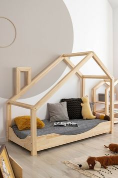 a dog house bed is in the middle of a room